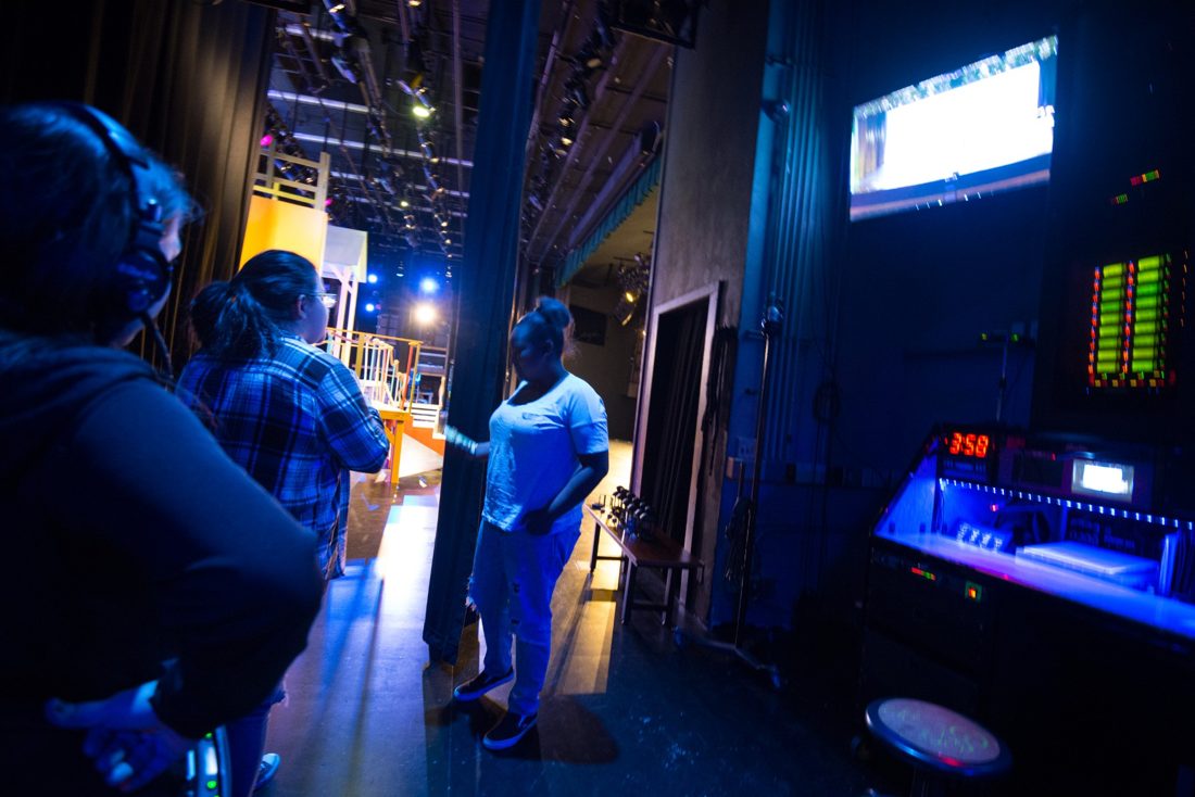 Crew working in the backstage wing during a show