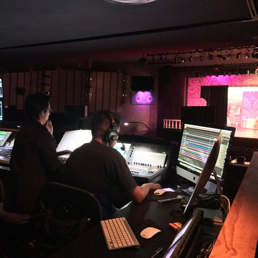 Students mixing a show from the tech booth