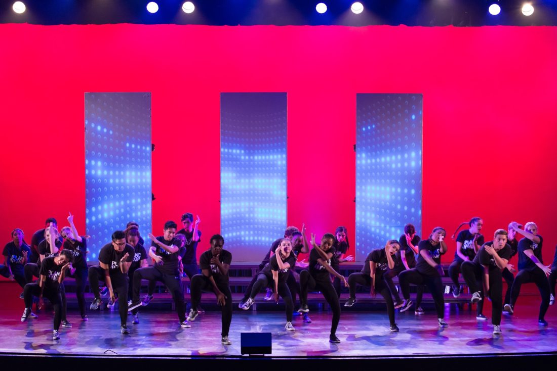 Dance performance under stage lights