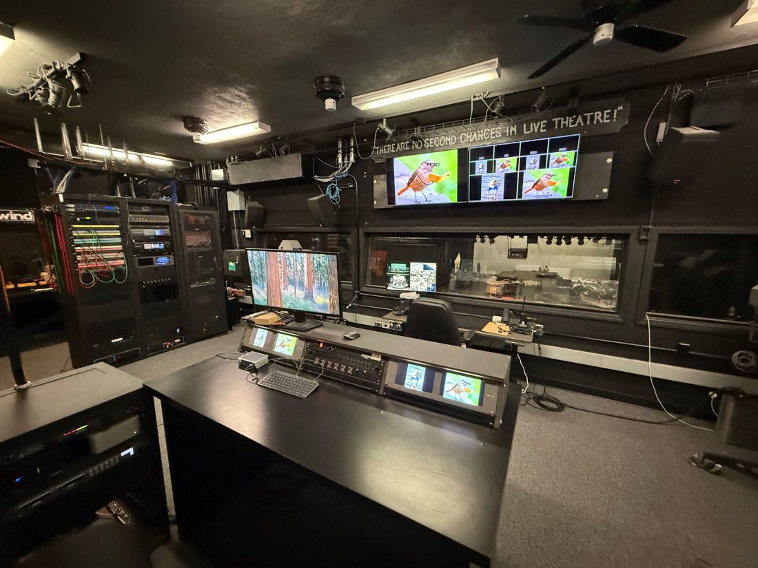 The video control booth with monitors, racks and switcher